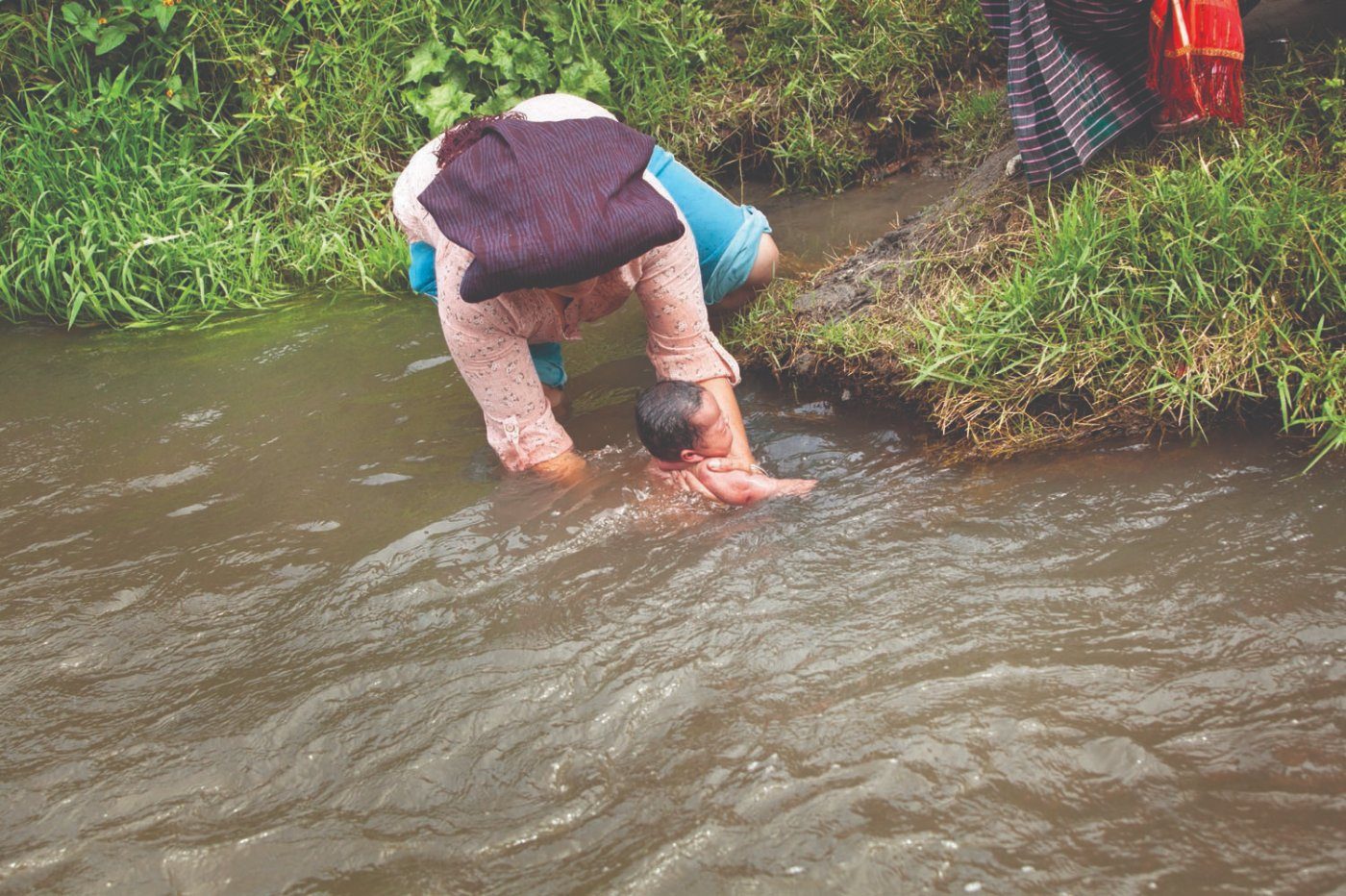 Bathing in the river during the Sirembah Ku Lau ritual, Tanah Karo